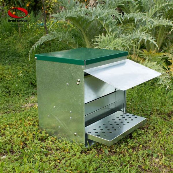 Treadle Poultry Feeder side in use